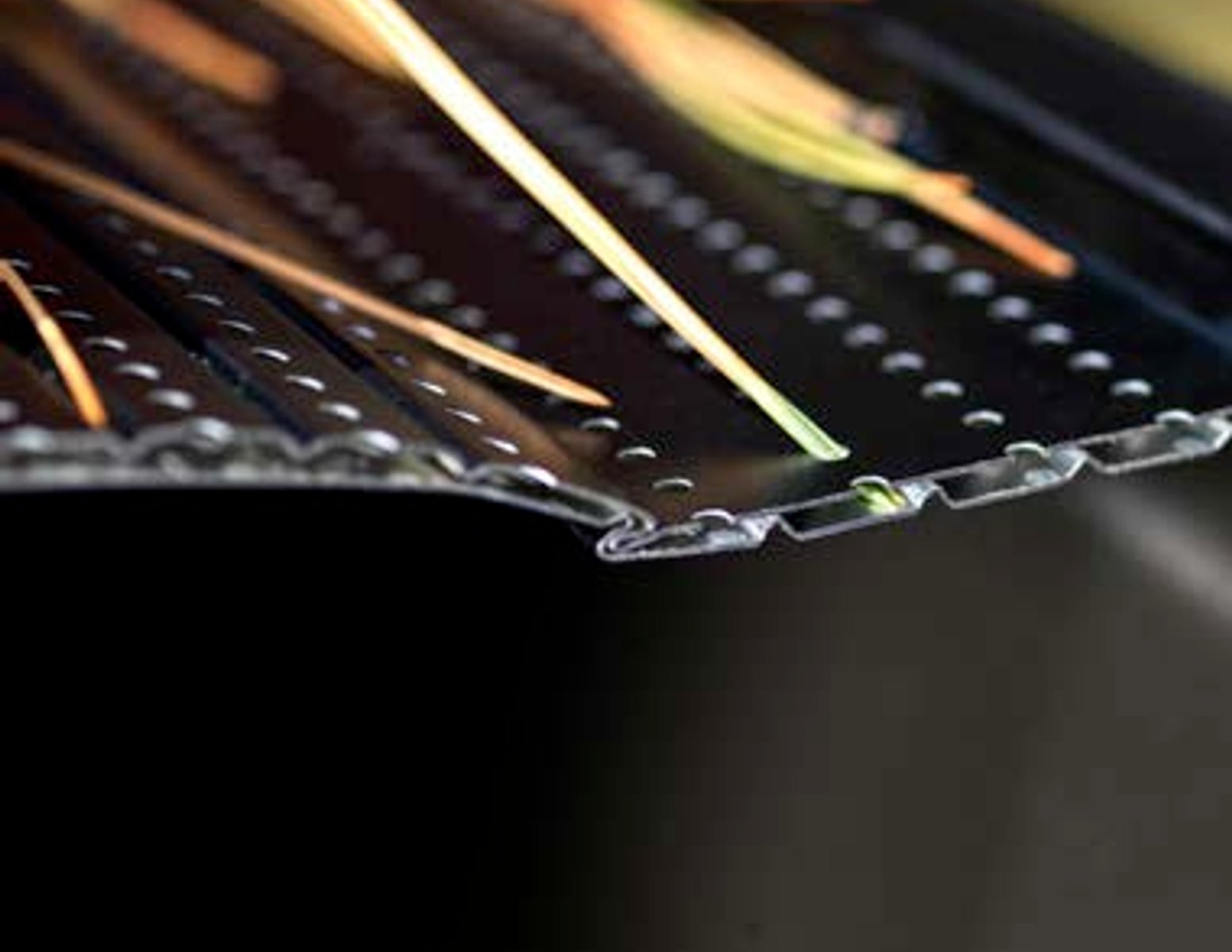 Gutter guard system close-up used by Olive Tree Exteriors