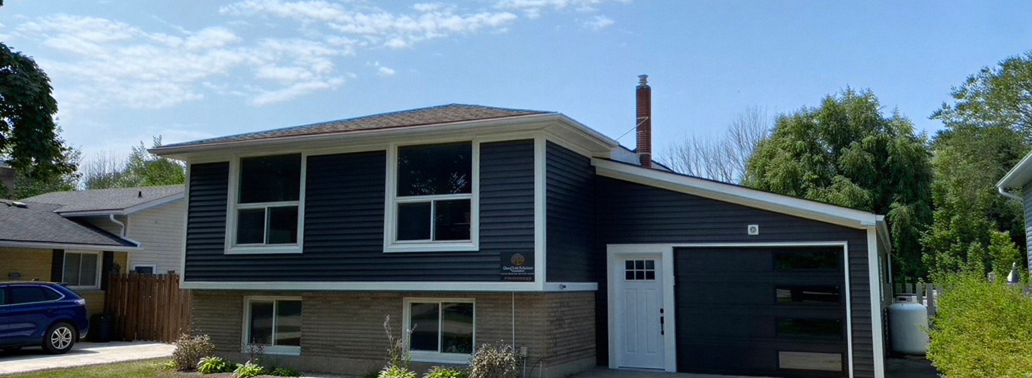 House with vinyl siding and gutters