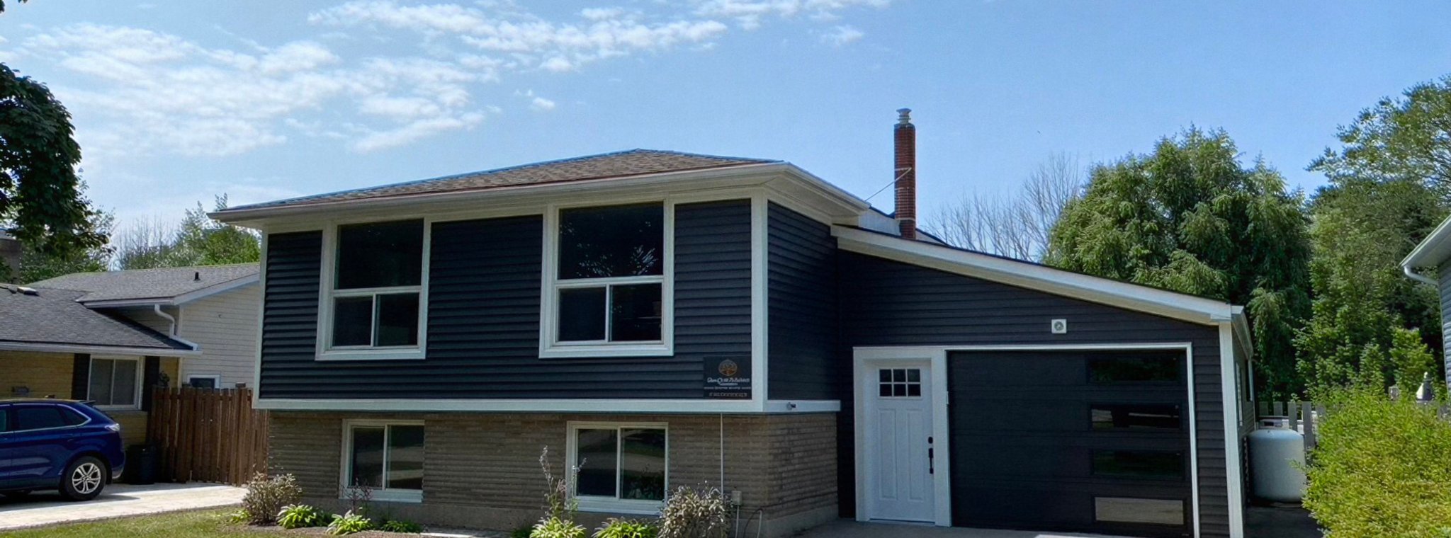 House with vinyl siding and gutters