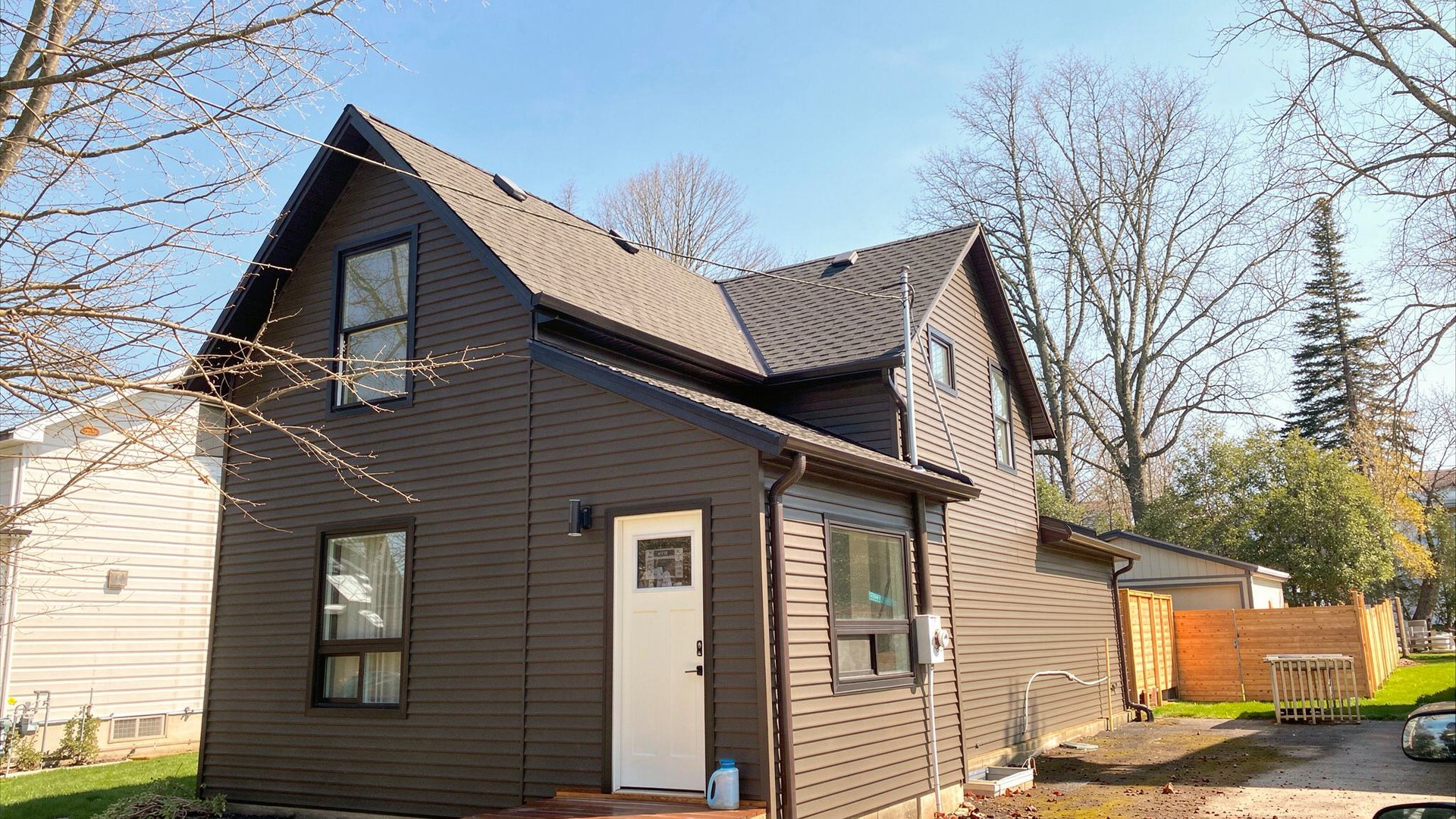 Port Elgin Home with vinyl siding and new eavestroughs under snow