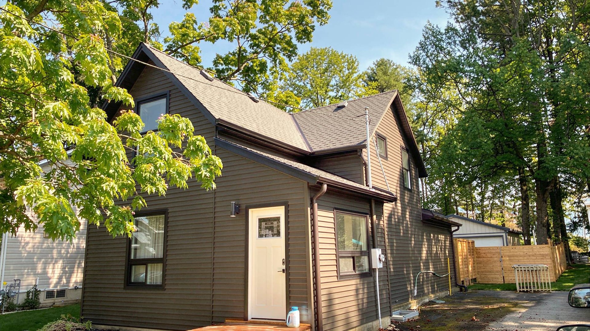 Port Elgin Home with vinyl siding and new eavestroughs under snow