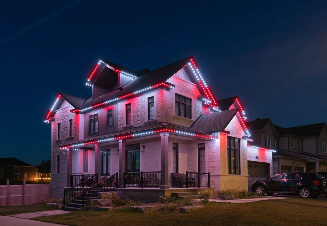 Celebright permanent outdoor lighting on a Port Elgin roofline at night