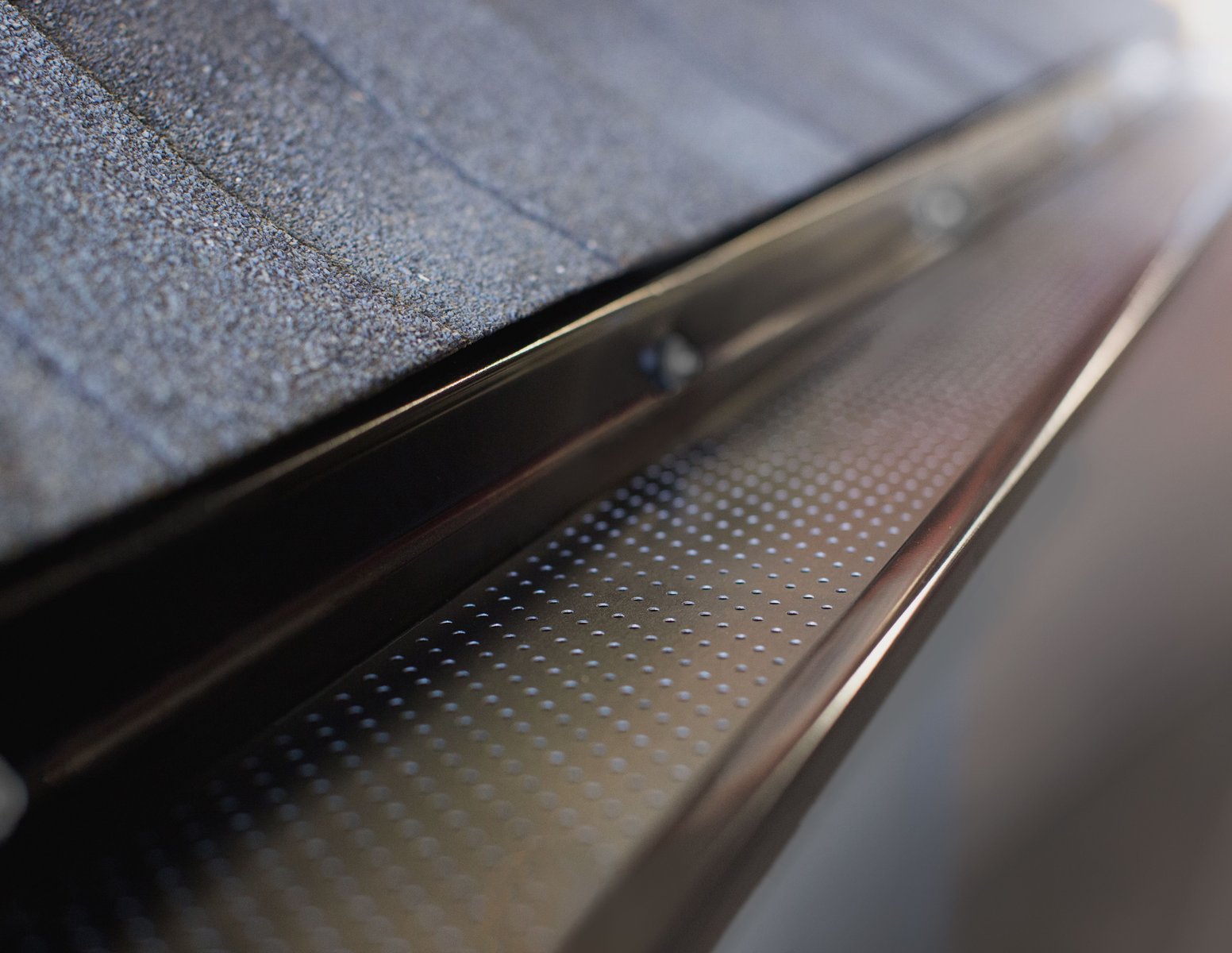 Gutter guard system close-up used by Olive Tree Exteriors